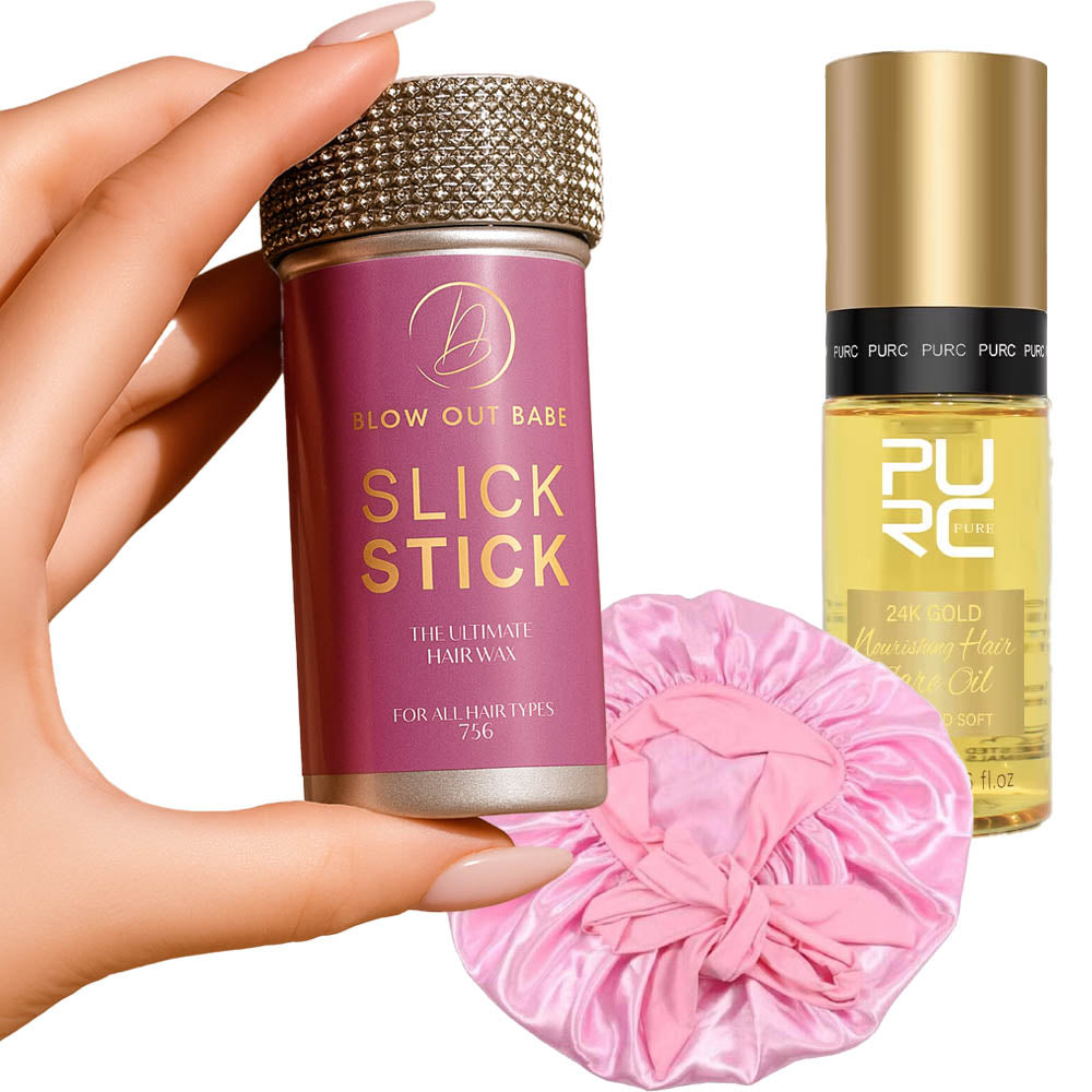 Hand holding a purple hair product with a pink scrunchie and gold bottle in the background